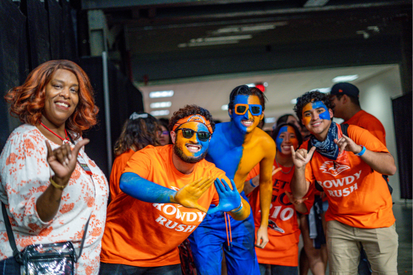 LT stands in the Alamodome tunnel with Rowdy Crew students ready to rush the field to begin the first football game